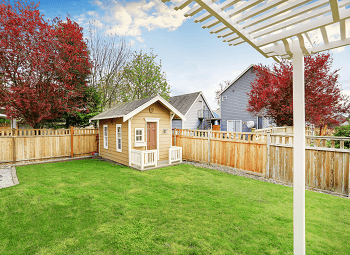 A nice shed in the back of a fenced in yard